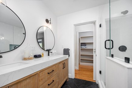 Eastham Cape Cod vacation rental - Primary bathroom with double sinks.