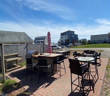 West Dennis Cape Cod vacation rental - Full patio & outdoor kitchen view facing toward Nantucket Sound