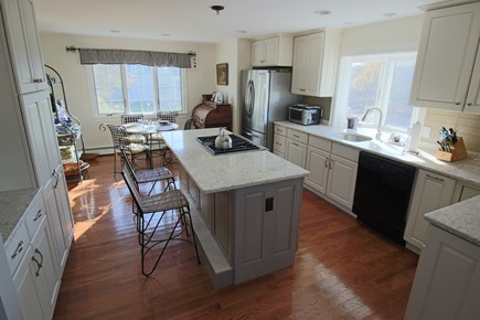 East Dennis Cape Cod vacation rental - Kitchen with granite & dining area beyond