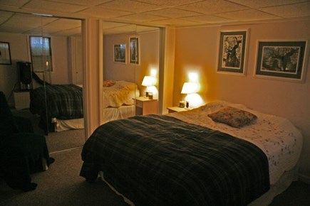 Harwichport Cape Cod vacation rental - Basement bedroom with queen bed and TV.