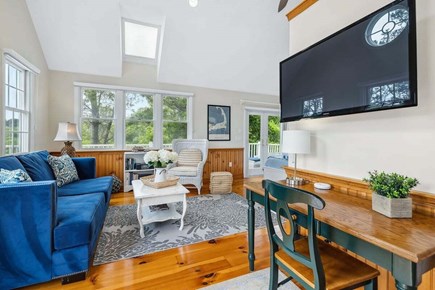 Chatham Cape Cod vacation rental - Seating area with TV and desk.