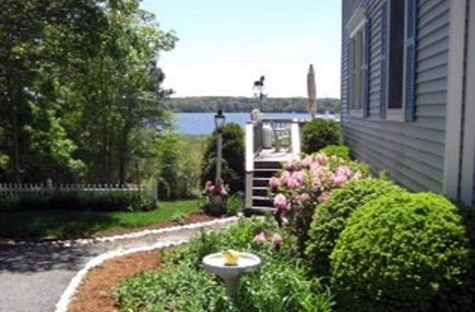 Yarmouth/Dennis Cape Cod vacation rental - Walkway to big 14’x24’ sundeck with picnic table & a Weber grill.