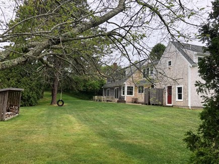 Pocasset Cape Cod vacation rental - Backyard with dining/ lounging area, outdoor shower and fire pit
