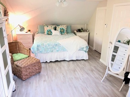 Cotuit /Mashpee line south of  Cape Cod vacation rental - Upper Level KIng Bedroom with 55 in TV and couch/sitting area.