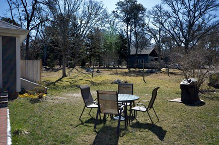 Brewster Cape Cod vacation rental - Enjoy meals outside Table has umbrella for 4 and gas grill.