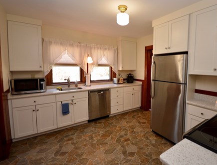 Brewster Cape Cod vacation rental - Full kitchen with door to backyard. Laundry room attached.