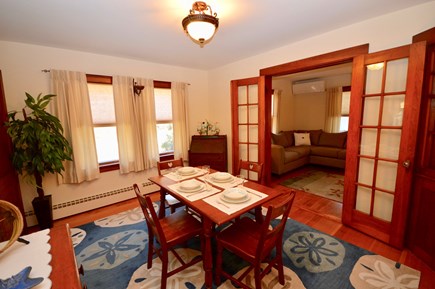 Brewster Cape Cod vacation rental - Dining room with doors into kitchen, living room and hall
