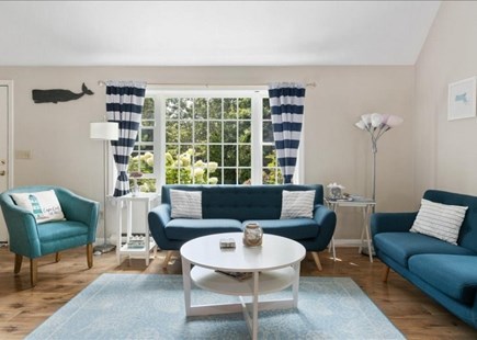 Harwich Cape Cod vacation rental - Open concept living room with cathedral ceilings and cozy seating