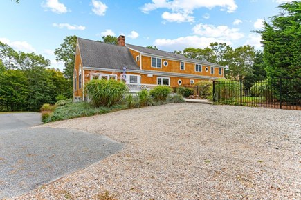 Brewster Cape Cod vacation rental - View of the parking area off the pool and back deck