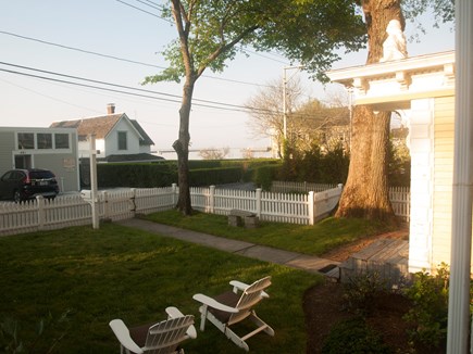 Provincetown Cape Cod vacation rental - Front yard with Adirondack chairs and view to harbor.