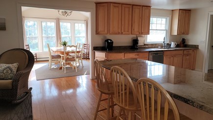 Brewster Cape Cod vacation rental - Open concept, kitchen, dining and sitting room. Toy box for kids.