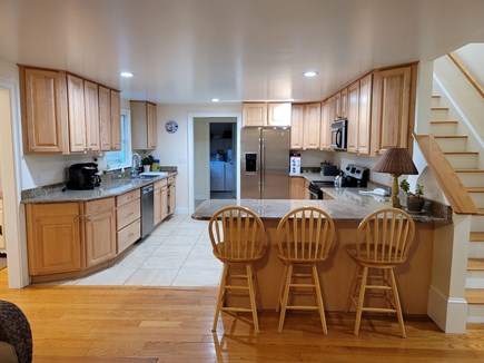 Brewster Cape Cod vacation rental - Kitchen looking to laundry room. open to dinning and sitting area