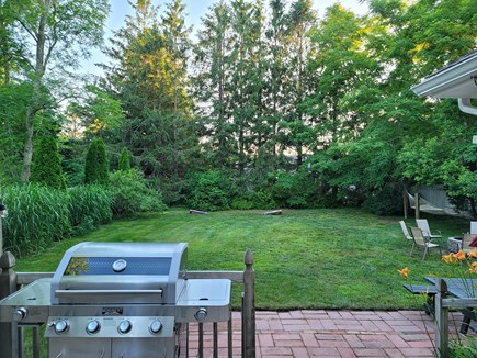 Brewster Cape Cod vacation rental - View of back yard looking towards hammocks on right