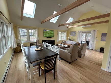 Truro Cape Cod vacation rental - New living/dining room with AC, gas FP, sliders to porch & deck