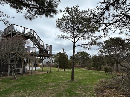 Truro Cape Cod vacation rental - View of side/back yard from driveway, showing 2nd/3rd floor decks