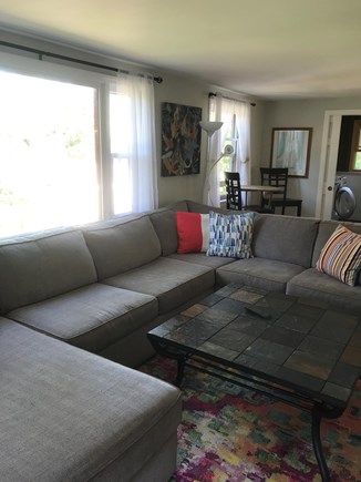 Eastham Cape Cod vacation rental - View of Sectional Couch and Bistro Seating by Corner Window