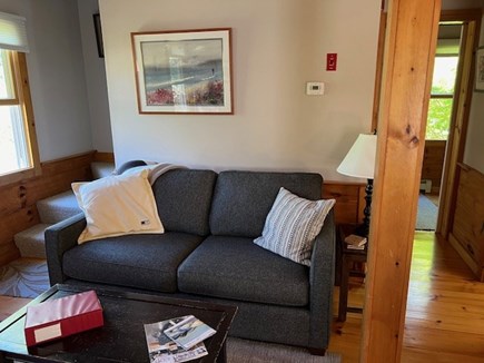 Eastham Cape Cod vacation rental - Living room couch and coffee table.  Den doorway to the right.