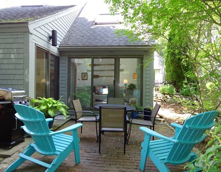 Mashpee/New Seabury Cape Cod vacation rental - Patio offers dining table, grill and Adirondack chairs
