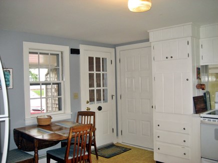 South Harwich Cape Cod vacation rental - Kitchen- Front Side Entry, Garage Door, Table/ Chairs