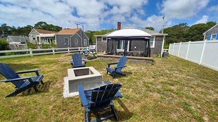South yarmouth Cape Cod vacation rental - Back yard with fire pit