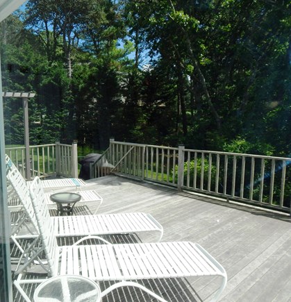 near South & West Chatham line Cape Cod vacation rental - Deck view of landscaped side yard and lower deck with gas grill