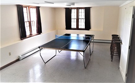 near South & West Chatham line Cape Cod vacation rental - Spacious daylight game area - ping pong, game table & chairs