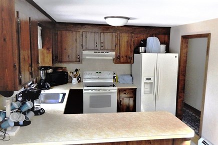 near South & West Chatham line Cape Cod vacation rental - Kitchen well equipped, peninsula divider with dining area.