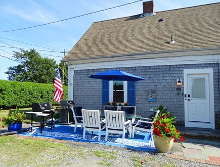 Dennis Port Cape Cod vacation rental - Patio area with two Weber grills, dining area