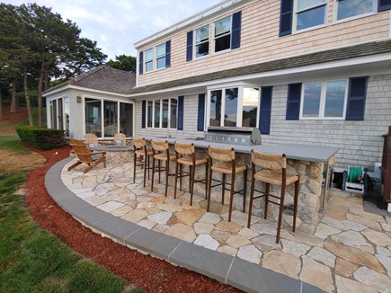 North Chatham Cape Cod vacation rental - Seating at the outdoor bar and kitchen and around the fire pit
