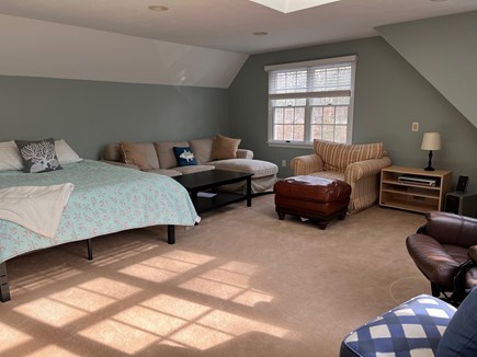 Brewster Cape Cod vacation rental - Bonus room above the garage with queen bed, couch and tv.