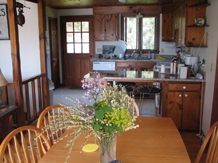 South Chatham Cape Cod vacation rental - Dining room table seats 8, kitchen has granite counter tops