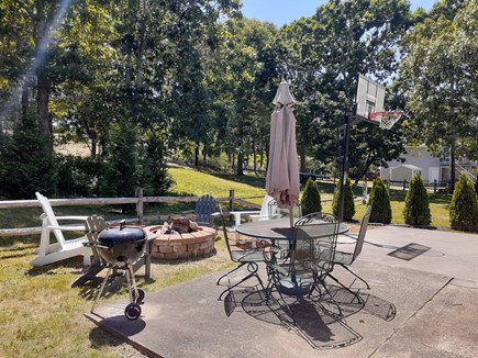 Wellfleet Cape Cod vacation rental - Back yard seating area with fire pit