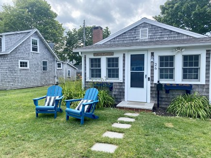 West Yarmouth Cape Cod vacation rental - Front of the house showing polywood Adirondack chairs