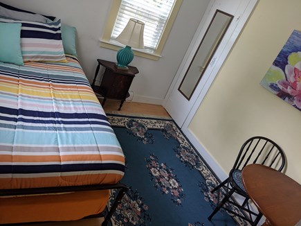 Harwich Cape Cod vacation rental - Main floor single trundle bedroom with small table and 2 chairs.