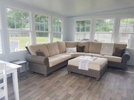 Harwich Port, Red River Beach Cape Cod vacation rental - Sun room with couch, table and tv