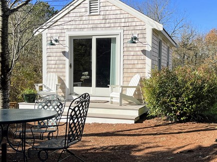 In The Heart of Brewster Cape Cod vacation rental - Ping Pong room and outdoor seating in a peaceful setting.