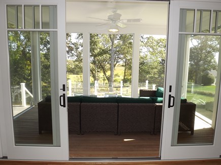 Chatham Cape Cod vacation rental - Screened-In Porch with Couch Off of Dining Area with Views.