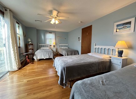 Falmouth, Teaticket Cape Cod vacation rental - Twin bedroom with four beds, TV, slider to upper deck