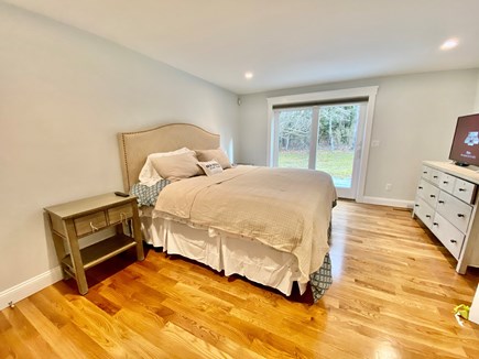 North Falmouth Cape Cod vacation rental - Master bedroom on 1st floor with walk-in closet and private deck