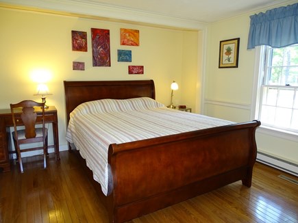 Yarmouth Port Cape Cod vacation rental - First floor queen bedroom with window views of flowers (TV/DVD)