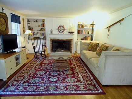 Yarmouth Port Cape Cod vacation rental - Living room with TV area and desk