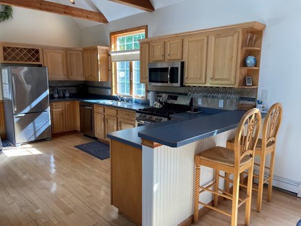 Eastham Cape Cod vacation rental - Large open kitchen with newer appliances, breakfast bar!