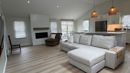 Popponesset Cape Cod vacation rental - Open floor plan w TV and sliding door to deck