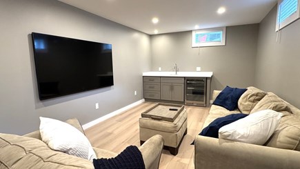 Popponesset Cape Cod vacation rental - Lower level living area with wet bar, beverage fridge, and 75" TV