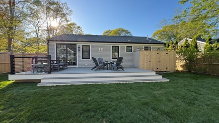 Popponesset Cape Cod vacation rental - Private back yard w deck, patio, firepit, 2 outdoor shwrs & TV