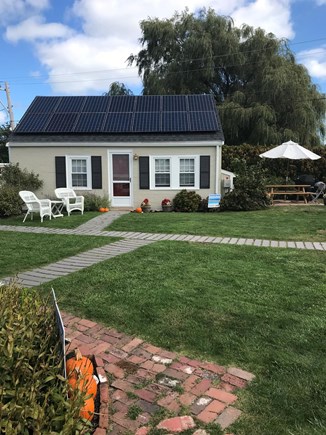 Wellfleet Cape Cod vacation rental - Cottage front with seating, side patio table, umbrella and grills