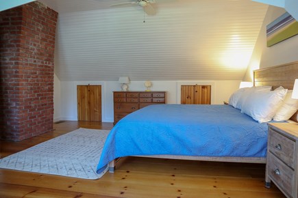 Brewster Cape Cod vacation rental - Exposed brick chimney and wide plank pine floors add to character