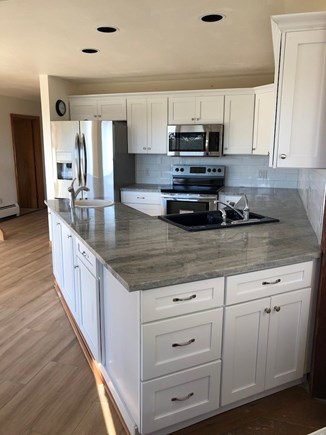 Truro Cape Cod vacation rental - New kitchen features stainless appliances, marble counters