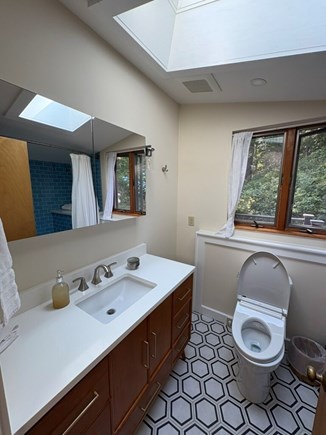Woods Hole Cape Cod vacation rental - Second floor bathroom with toilet/bidet, shower/tub and sink.