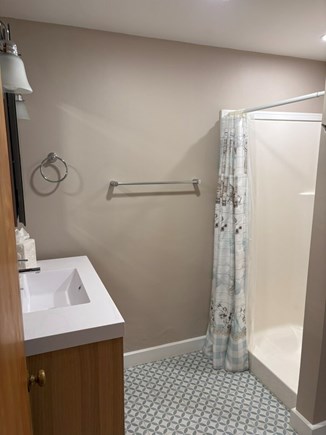Woods Hole Cape Cod vacation rental - First floor bathroom with shower, sink and toilet.